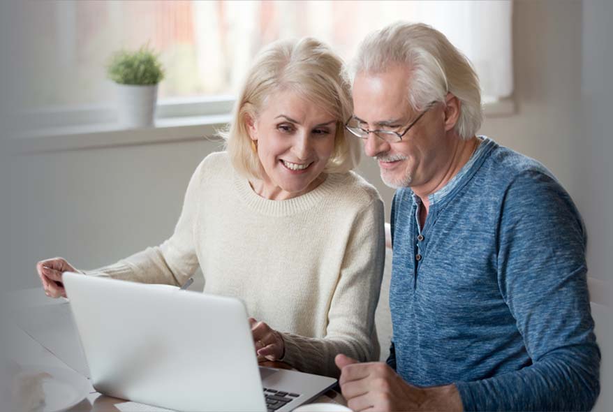 home-couple-using-laptop